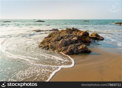 waves in the ocean and rocks in the water