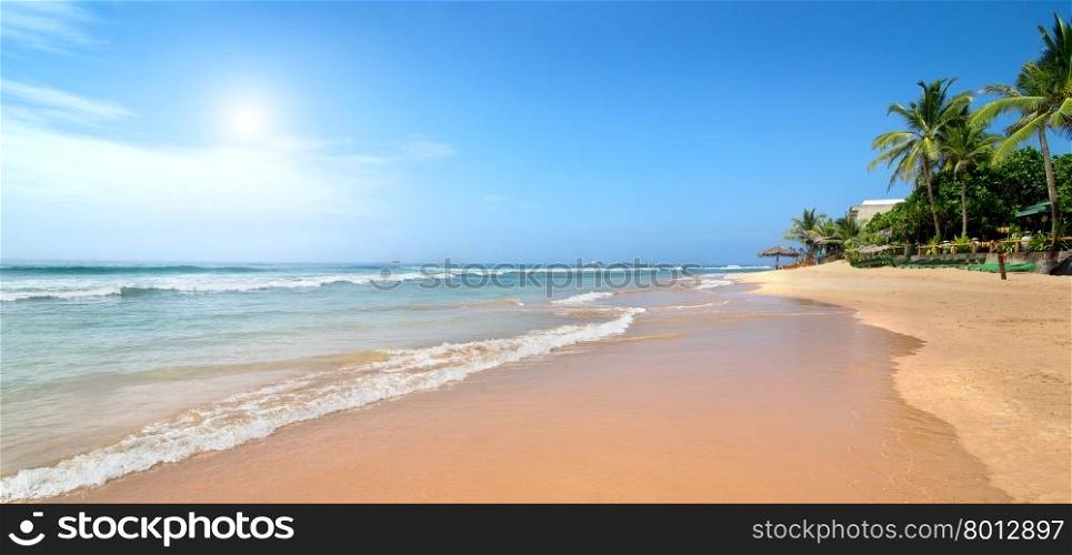 Waves of the ocean on sandy beach