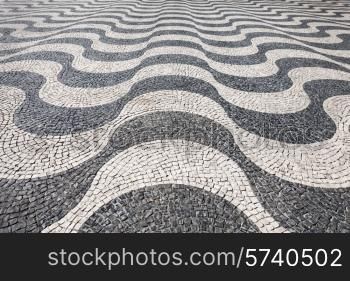 Waves of tiled floor in portuguese traditional style, Rossio square, Lisbon