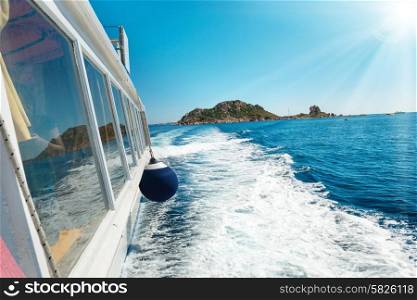 Waves on blue sea behind the speed boat in sunny day