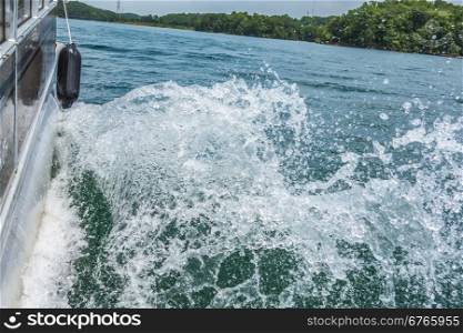 Waves on lake behind the speed boat