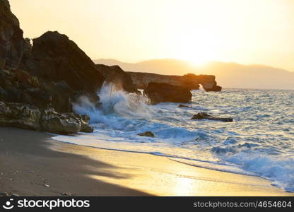 waves splash at stones on shore sea