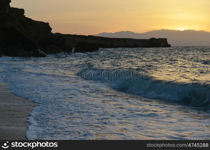 waves splash at stones on shore sea