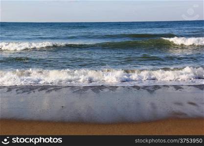 Waves wash over sand on Black Sea beach