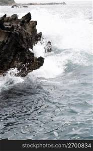 Wavey ocean crashing on rocks