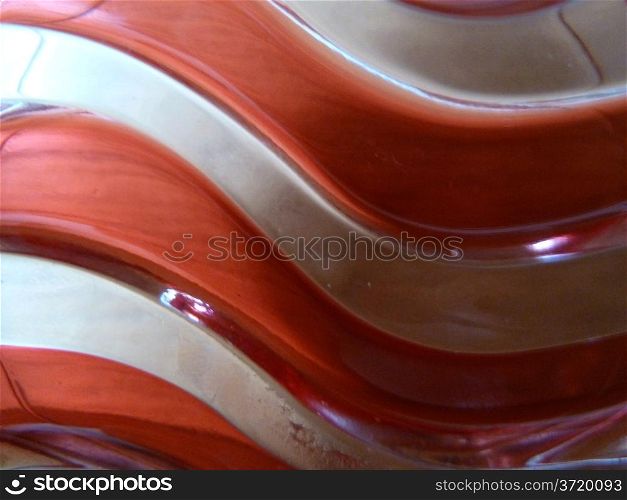 Wavey red. Waves red pattern in glass as a background