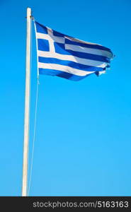 waving greece flag in the blue sky and flagpole