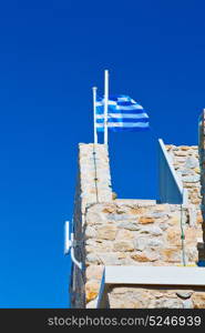 waving greece flag in the blue sky and flagpole