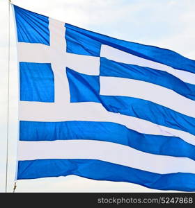 waving greece flag in the blue sky and flagpole