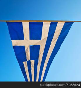 waving greece flag in the blue sky and flagpole