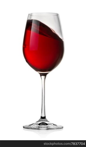 Waving red wine in a glass isolated on a white background