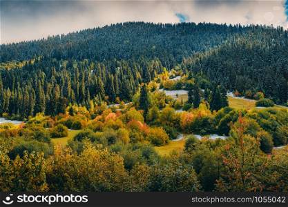 Way to zuruldi mountain, beautiful autumn landscape scenery with snow and yellow colors. Mestia, Svaneti, Georgia