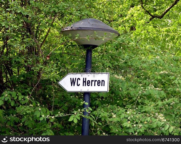 WC Men. signboard in a park: WC Men