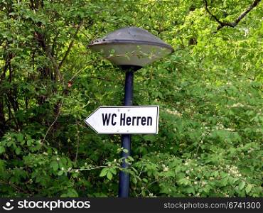 WC Men. signboard in a park: WC Men