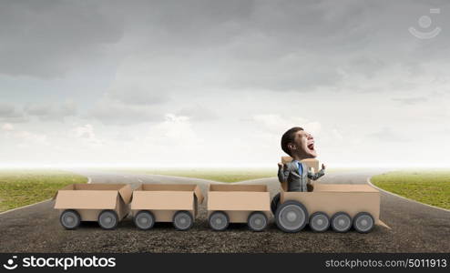 We deliver fast. Funny image of businessman riding in carton train