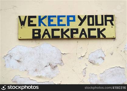 WE KEEP YOUR BACKPACK signboard at a store, Pisac, Sacred Valley, Cusco Region, Peru