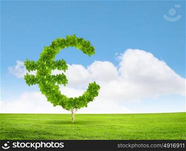 Wealth concept. Conceptual image of green plant shaped like euro symbol