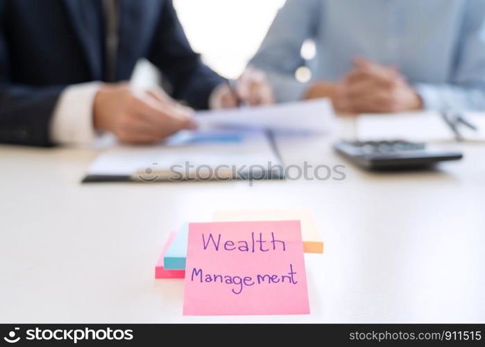 wealth management concept, business man and team analyzing financial statement for planning financial customer case in office