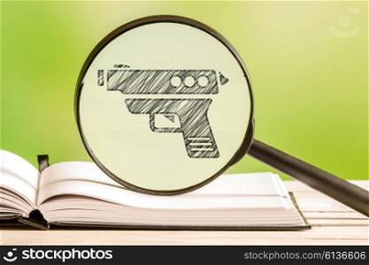 Weapon information with a pencil drawing of a gun in a magnifying glass
