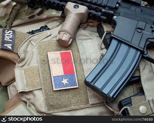 Weapon series - the Black Rifle and the Texas State flag patch on a bulletproof vest