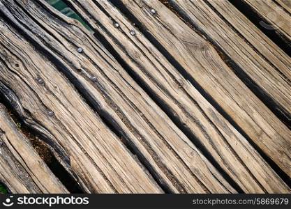 Weathered and rough textured wooden bridge