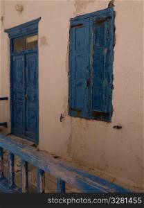 Weathered blue door in Mykonos Greece