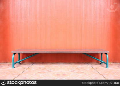 Weathered chair in dark brown wood background.