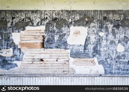 weathered plaster wall in an abandoned school in rural Nebraska