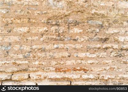 Weathered stained old brick wall background.