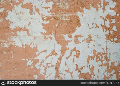 Weathered wall painted in light brown color