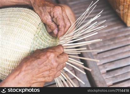 weaving bamboo basket wooden / old senior man hand working crafts hand made basket for nature product in Asian