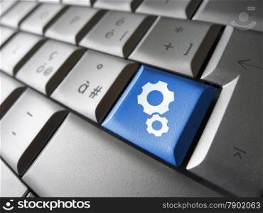 Web account, technology support and website settings concept with two gears icon and symbol on a blue laptop computer key for Internet and online business.