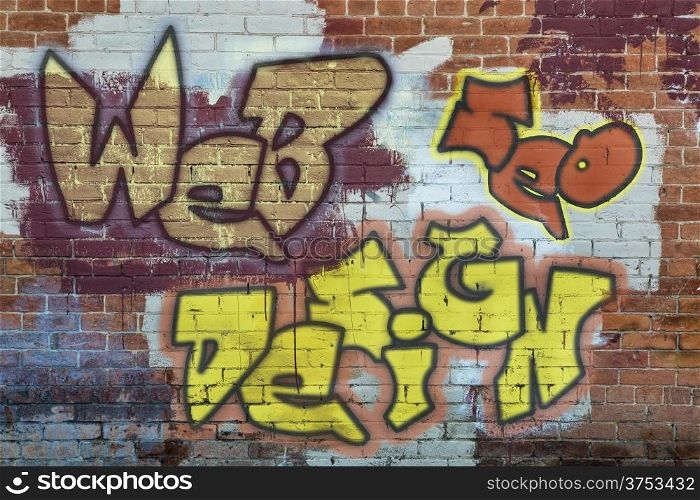 web and SEO design - colorful graffiti text on a grunge brick wall
