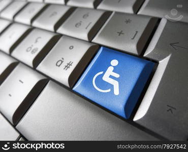 Web content accessibility concept with wheelchair icon and symbol on a blue computer key for blog and online business.