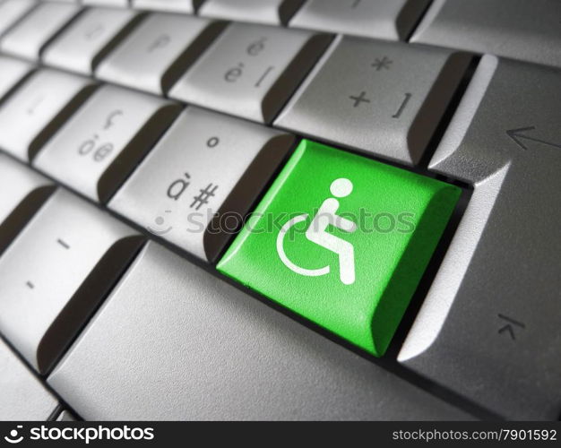 Web content accessibility concept with wheelchair icon and symbol on a green computer key for blog and online business.