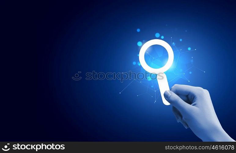 Web searching. Close up of male hand holding digital icon
