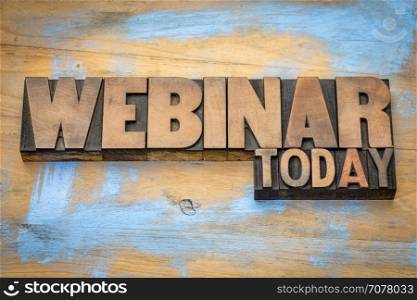 webinar today sign - word abstract in vintage letterpress wood type against grunge painted wood