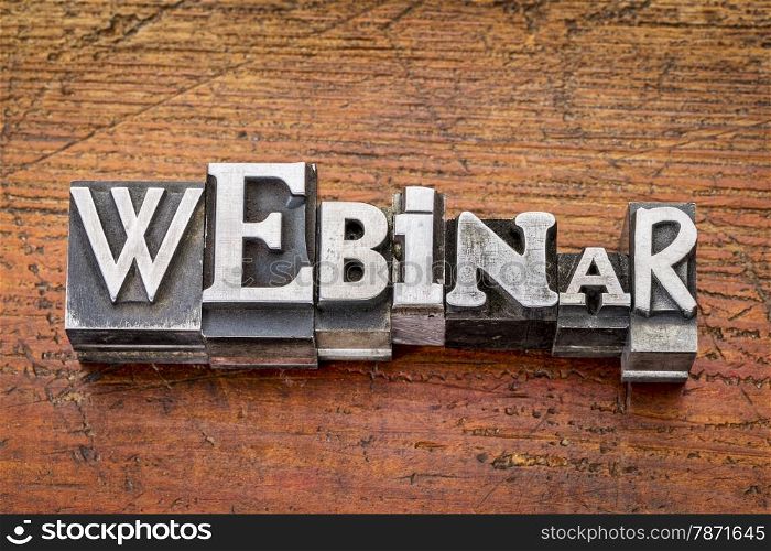 webinar word in vintage metal type printing blocks over grunge wood, mixed fonts in style and size