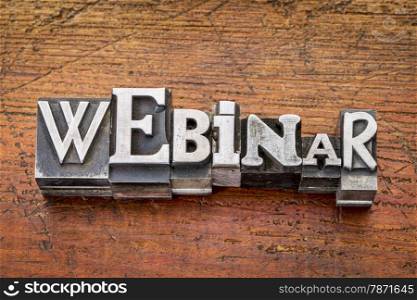 webinar word in vintage metal type printing blocks over grunge wood, mixed fonts in style and size