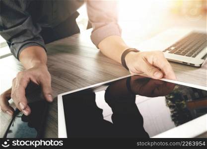 Website designer working blank screen digital tablet and computer laptop with smart phone on wooden desk as concept