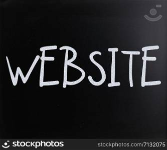 ""Website" handwritten with white chalk on a blackboard"