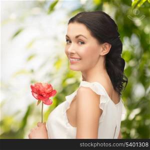 wedding and beauty concept - young woman with flower