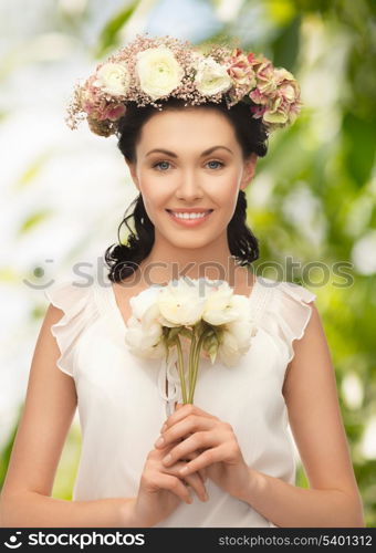 wedding and beauty concept - young woman with flower