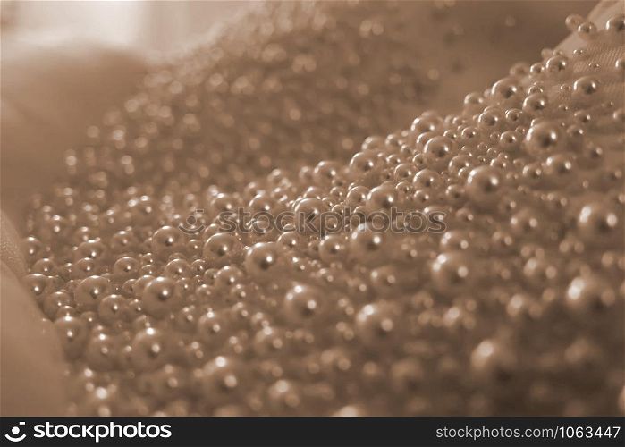 Wedding background. Close-up of pearls bridal dress details, powdery colo, tenderness. Wedding background. Close-up of pearls bridal dress details, powdery color, tenderness.