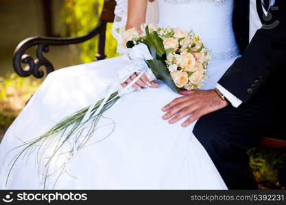 Wedding bouquet from peach-coloured roses and buds