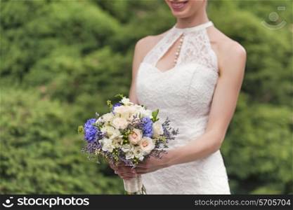 Wedding bouquet in bride&rsquo;s hand, closeup view&#xA;