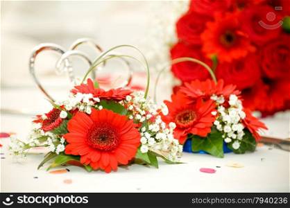 wedding bouquet of red roses, daisies and foliage