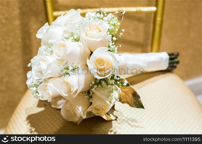 Wedding bouquet of roses with two rings on a pillow. Wedding bouquet of roses with two rings