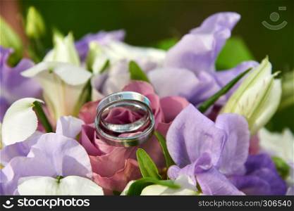 wedding bouquet with roses and rings