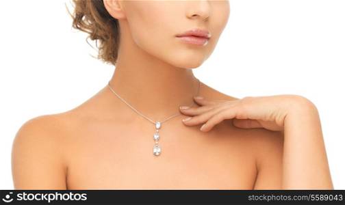 wedding, bridal jewelry and luxury concept - beautiful woman wearing shiny diamond necklace